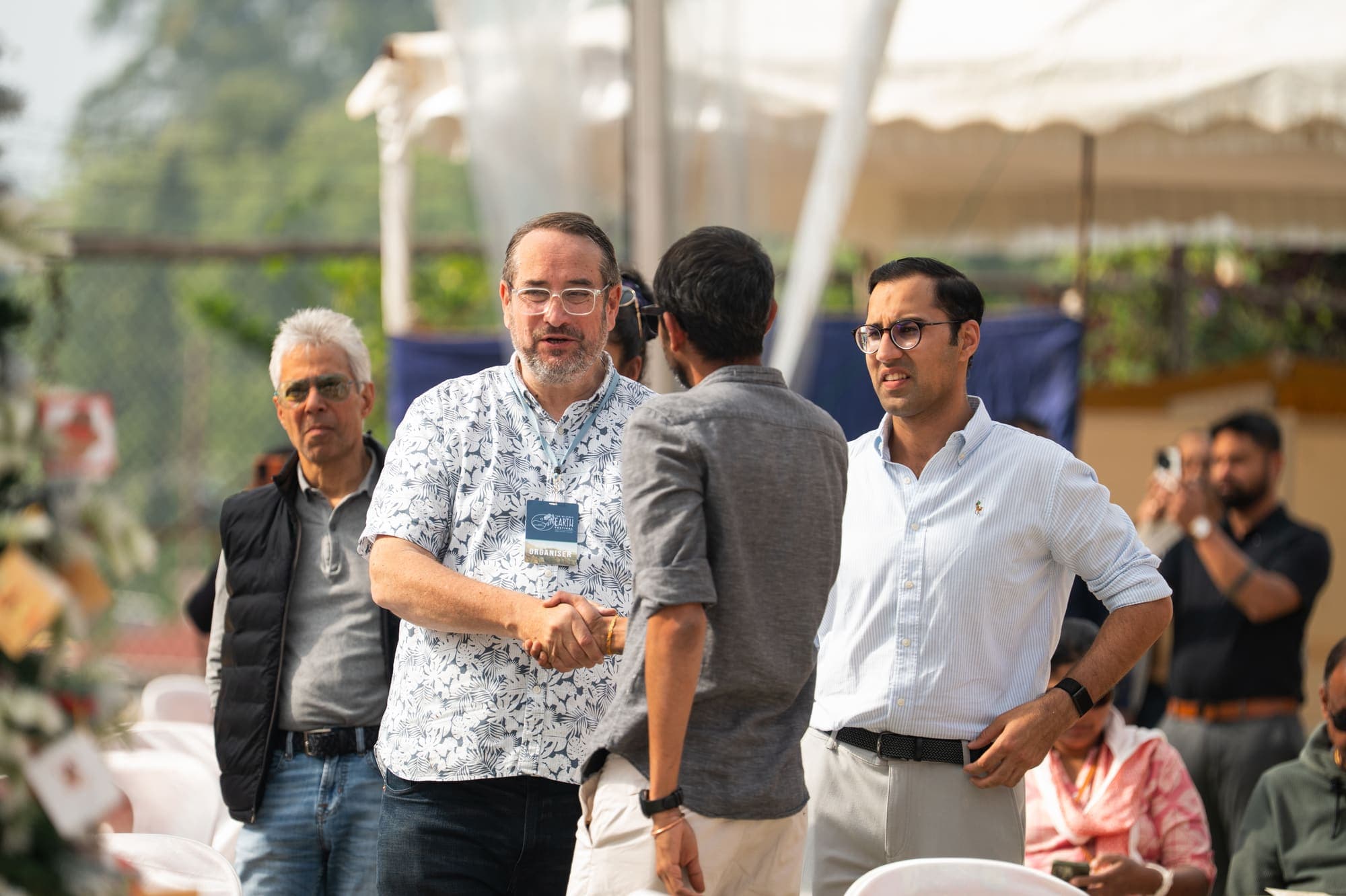 Guests in conversation beside the marquee