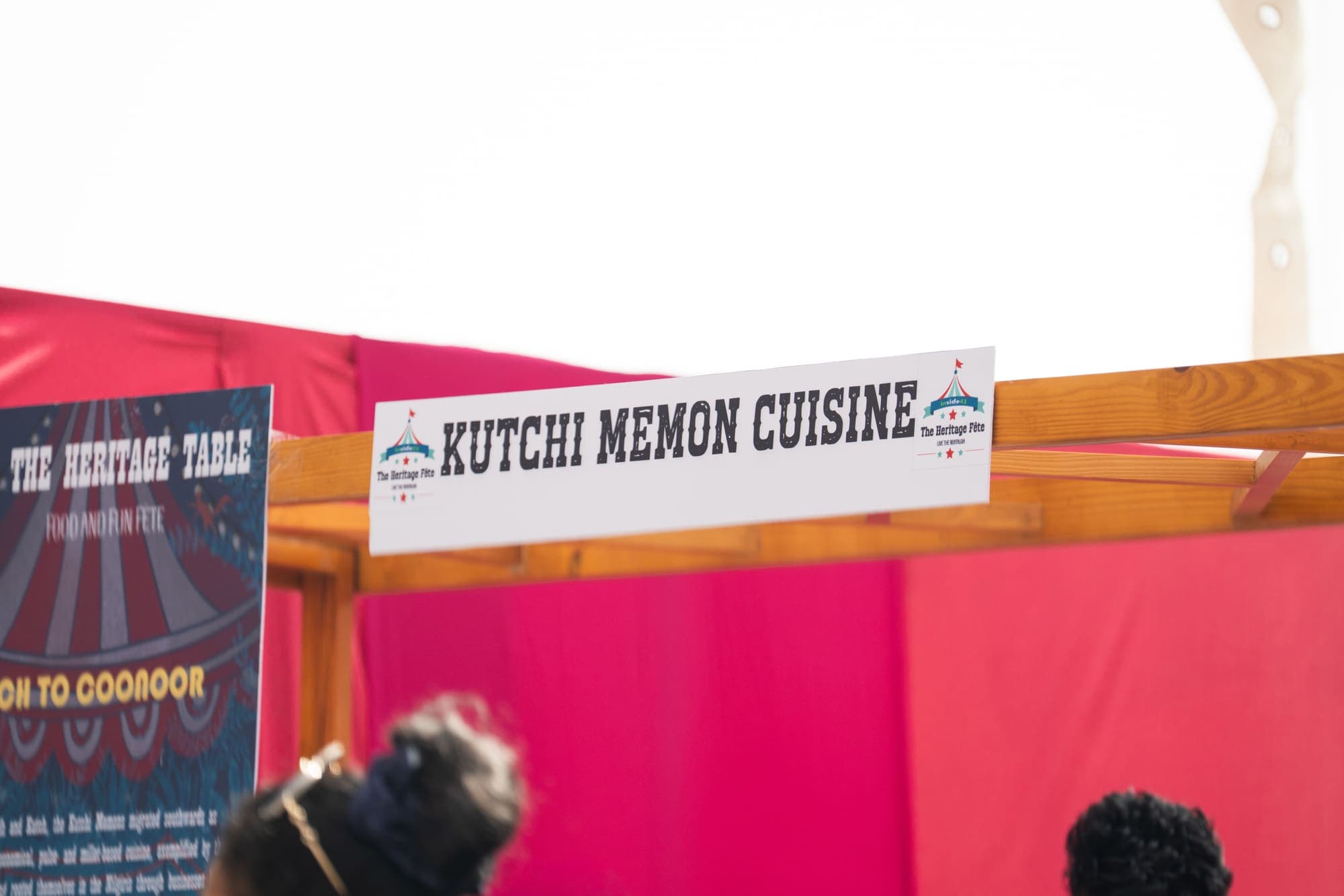 Hand-lettered sign for the Kutchi Memon Cuisine stall