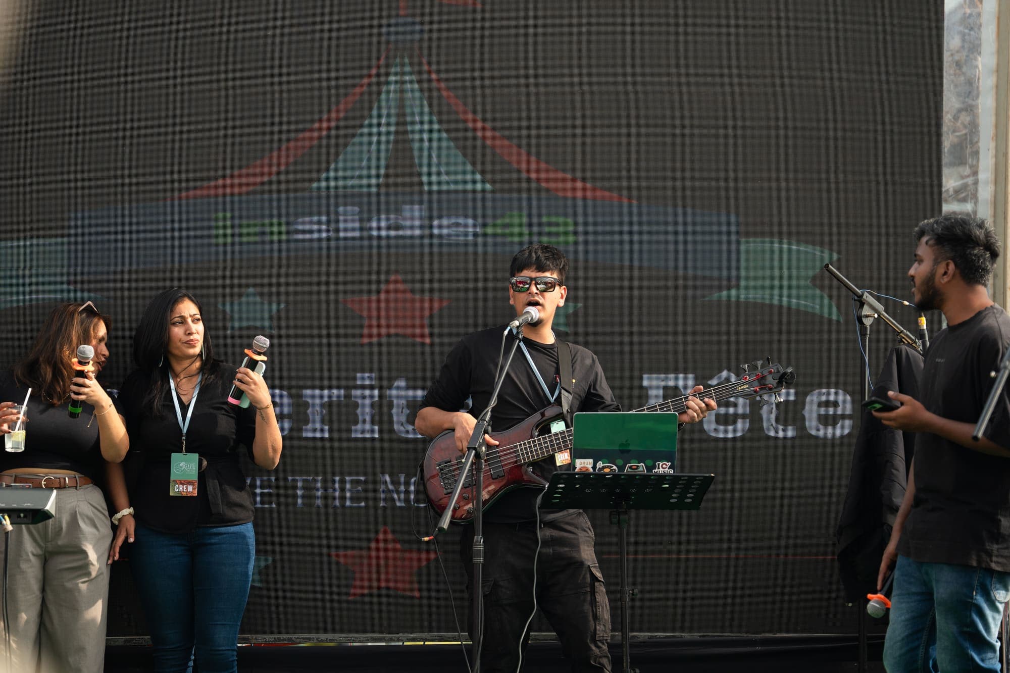 The house band performing under the inside43 stage backdrop