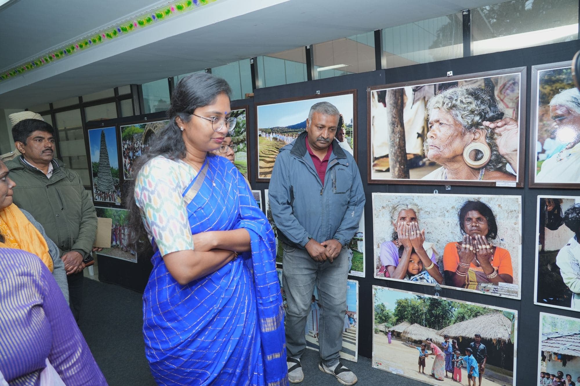 Visitors viewing the framed photograph exhibition